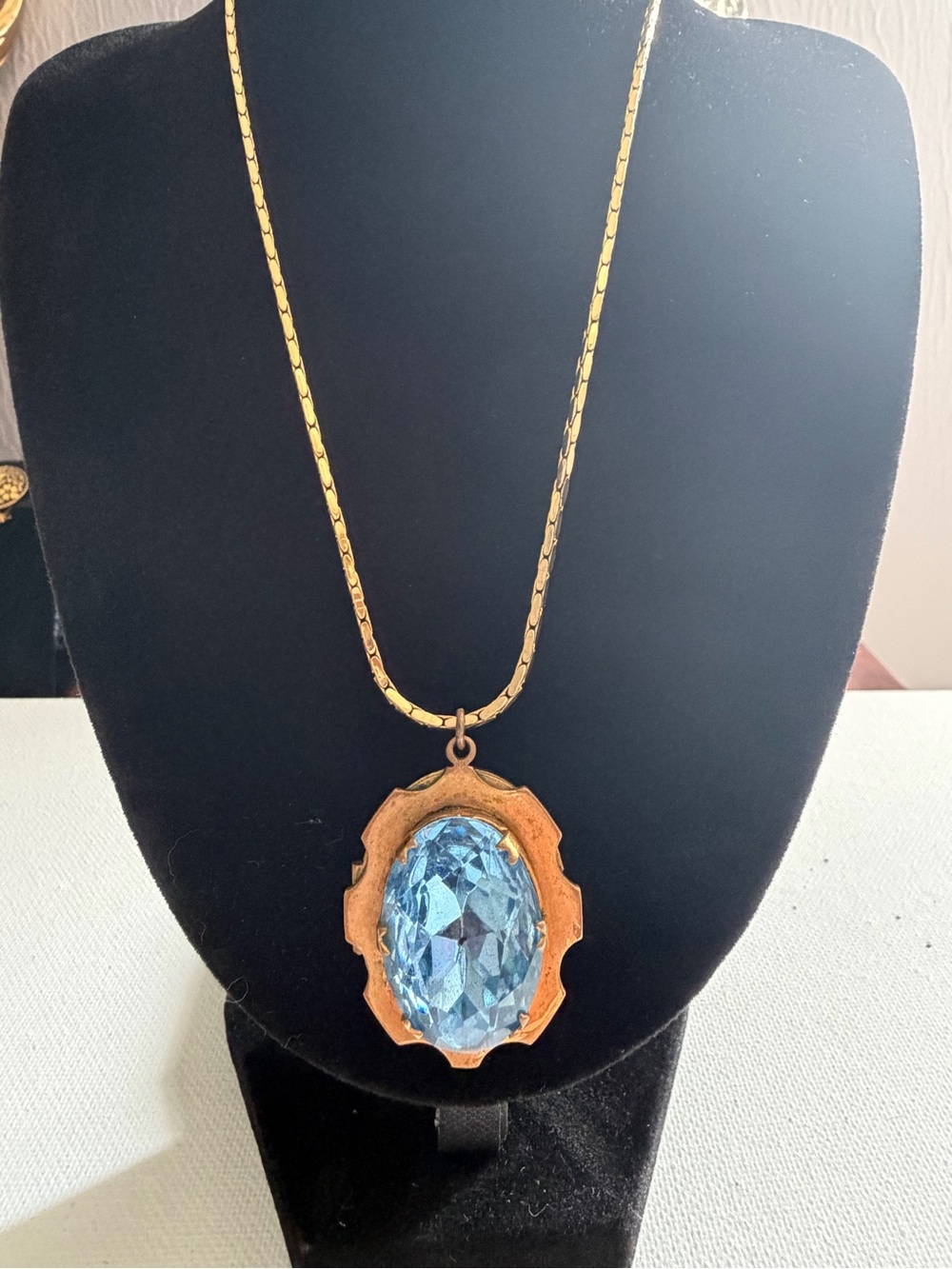 Vintage 1950’s/1960 victorian revival gold tone oval locket blue faceted stone